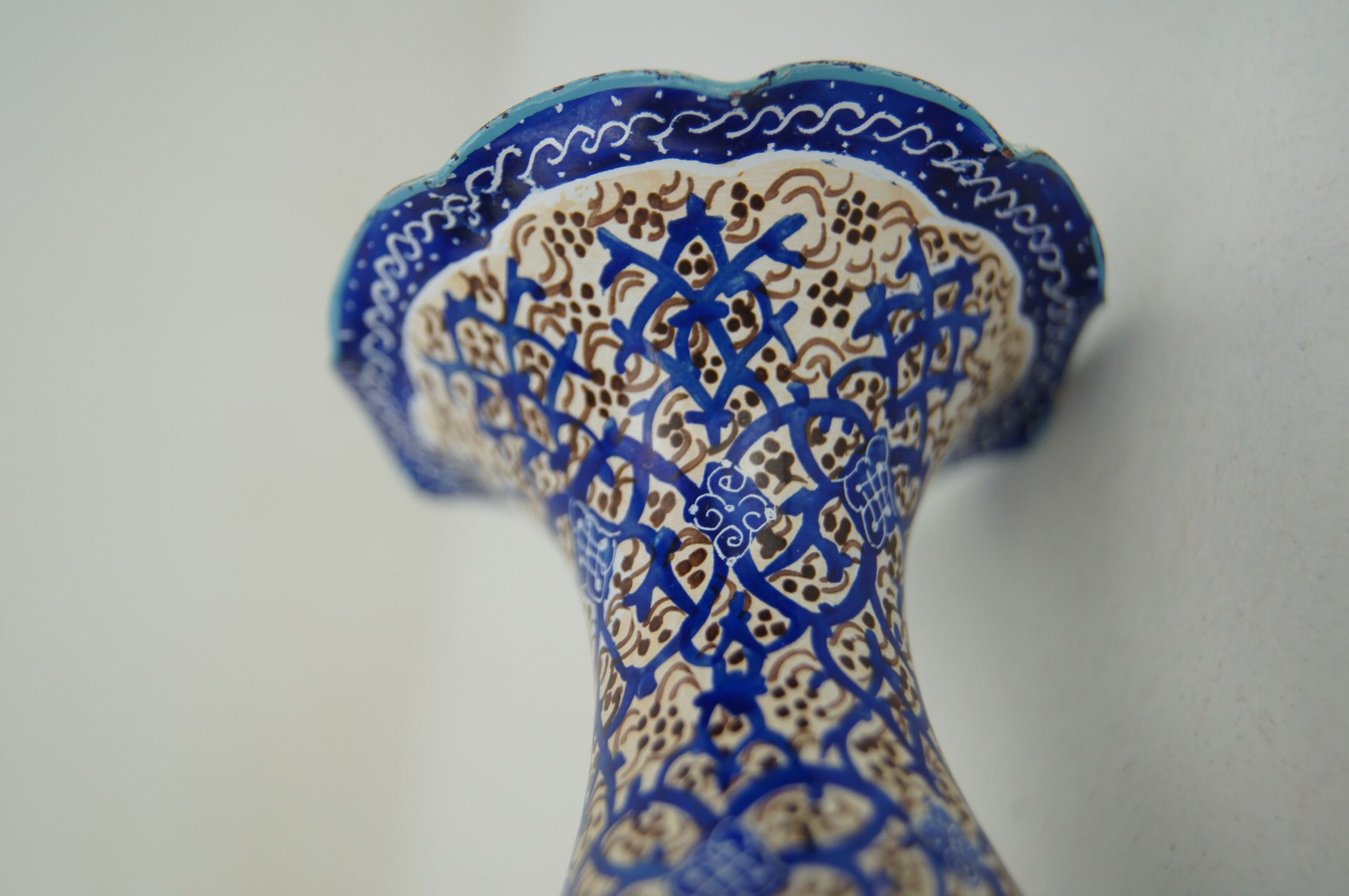 Piriform vase with a flared metal collar enamelled with a polychrome decoration, marked "Amini Iran" on the reverse.