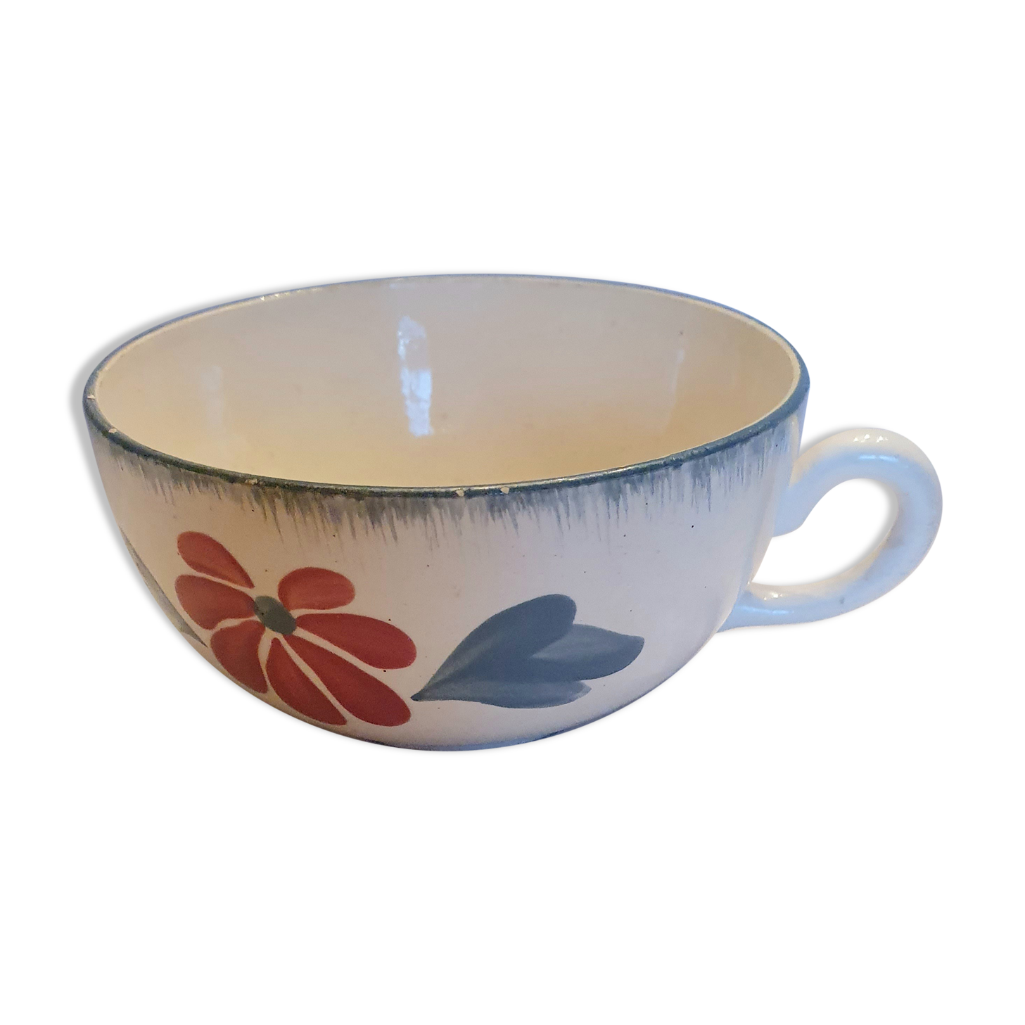 Old big cup in faience with flower decoration