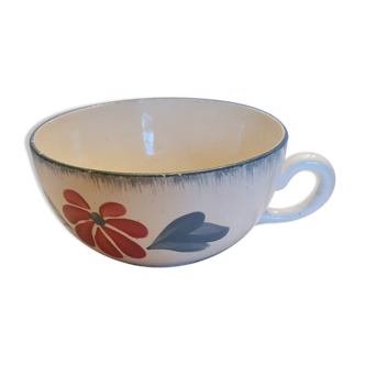 Old big cup in faience with flower decoration
