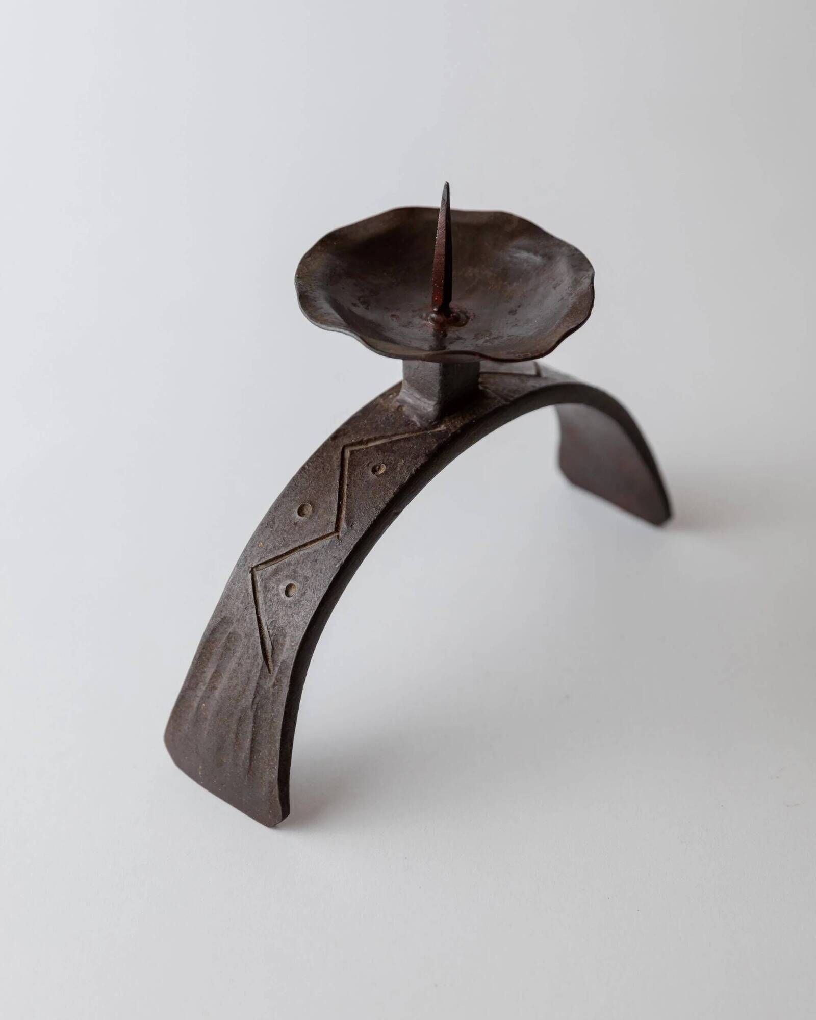 Vintage wrought iron candlestick from the 1960s, sculptural relief pattern for pillar candle, rustic Mid-Century metal, elegant gift idea.