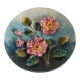 Decorative plate with relief floral pattern in majolica.