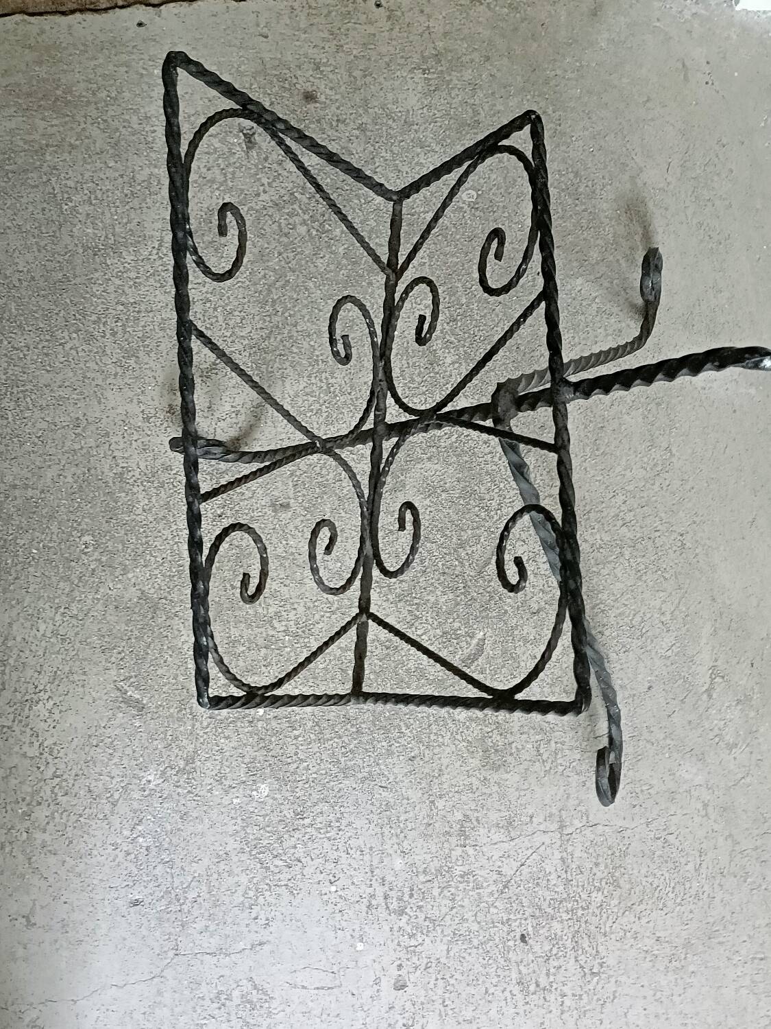 Vintage wrought iron magazine rack