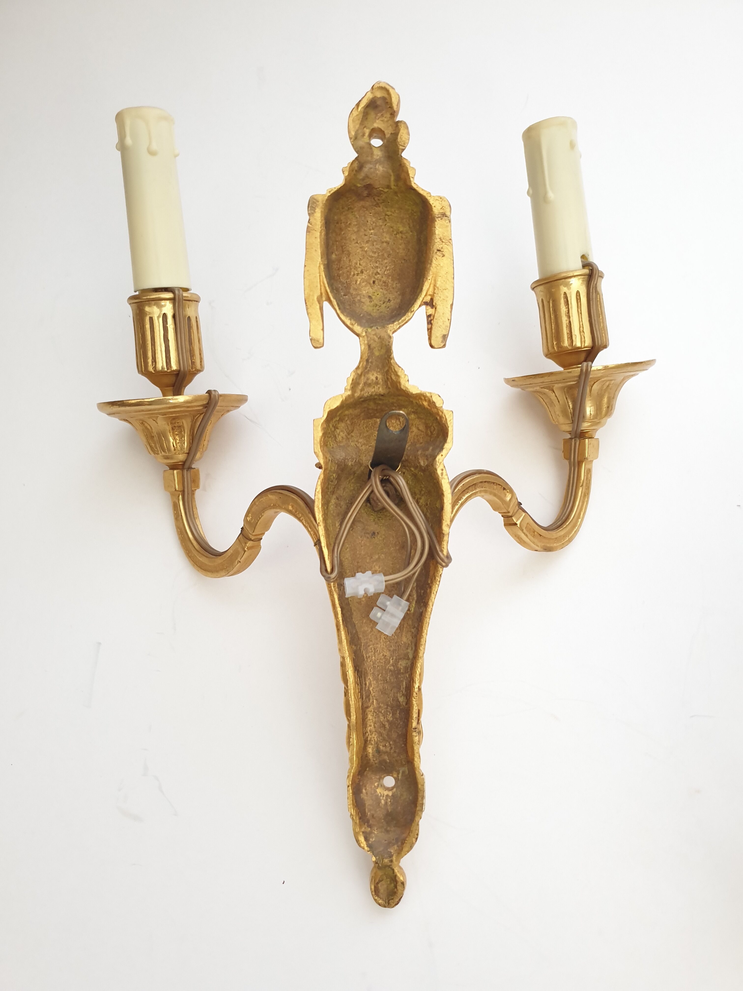 Paire d'applique de style Louis XVI  XXe bronze doré belier