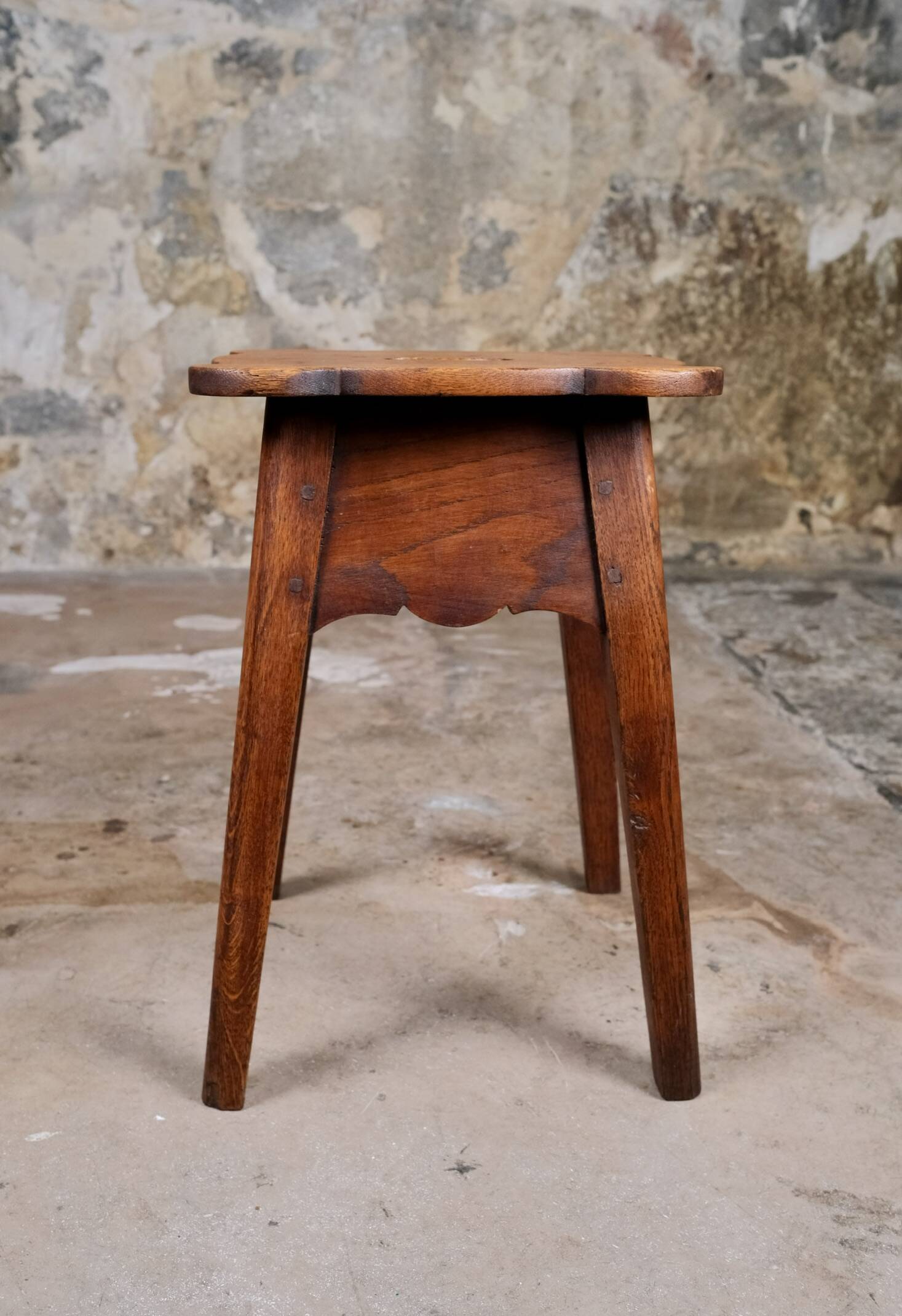 Pair of scalloped oak stools, France, early 20th century