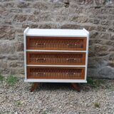 Scandinavian chest of drawers made of wood and rattan