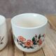 Set of 3 vintage ceramic cups with floral decoration.