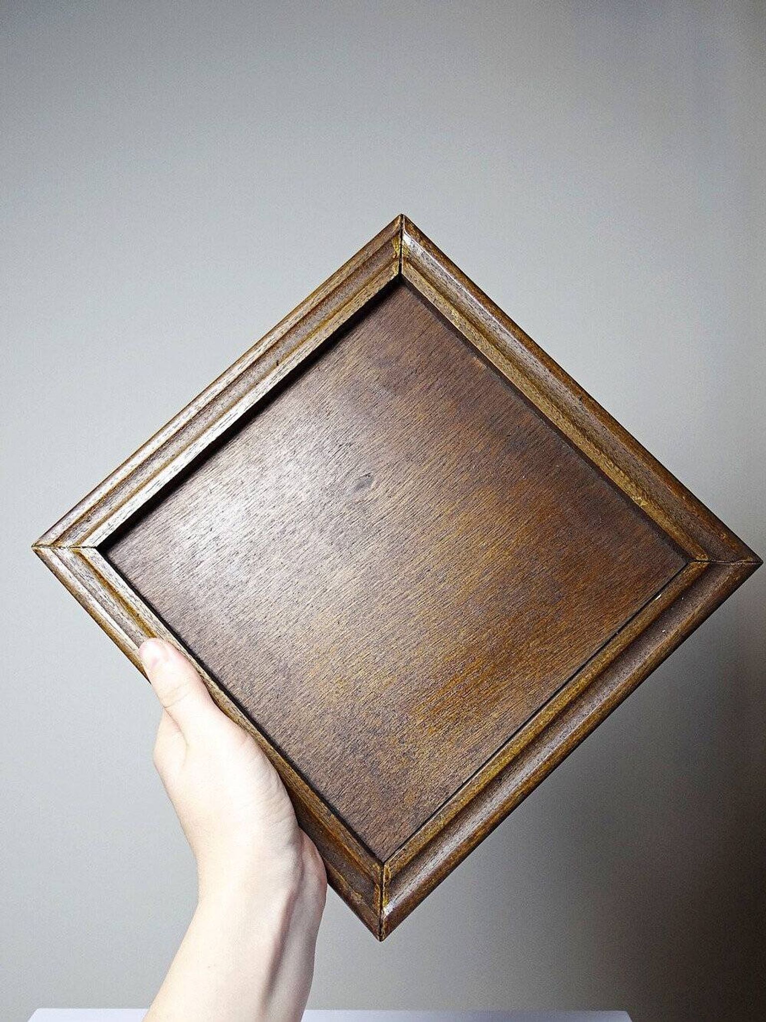 Vintage ceramic and wooden trivet, circa 1960-1970.