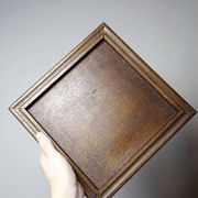 Vintage ceramic and wooden trivet, circa 1960-1970.