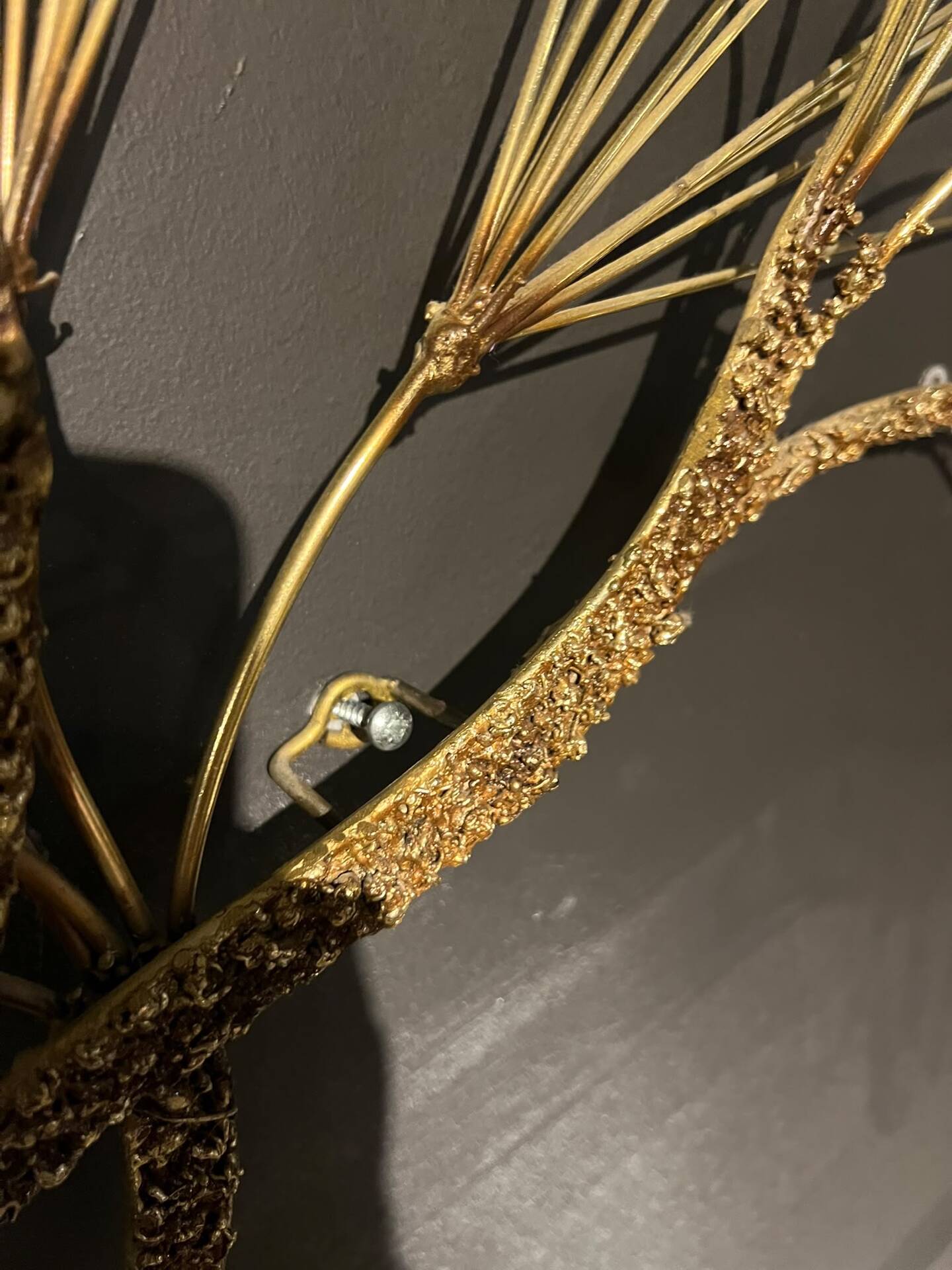 Large wall sculpture in the shape of a tree needle in brass by Curtis Jeré, mid-century modern.