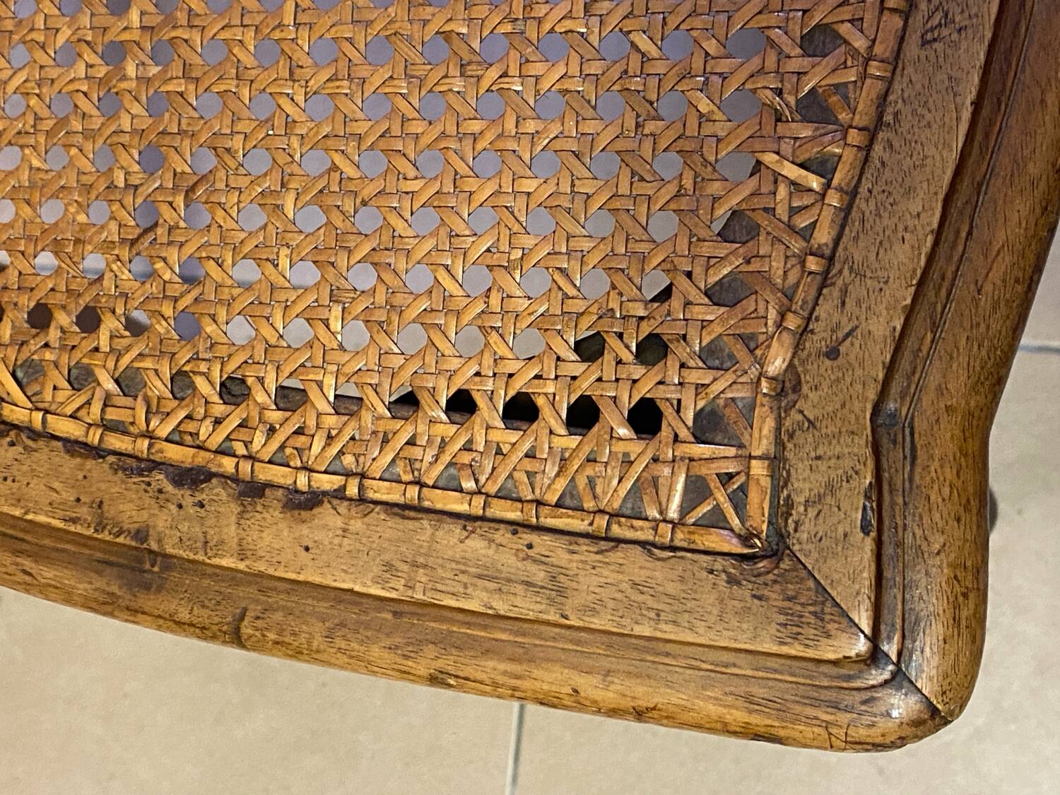 Chair with caned seat and back made of wood