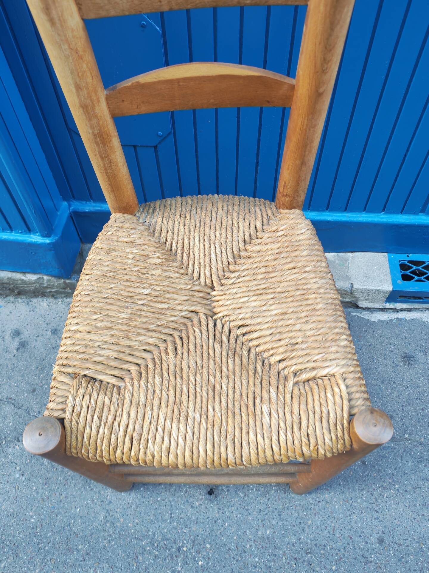 Neo-rustic chair in wood and wicker in the brutalist style by Charles Dudyoyut.