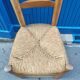 Neo-rustic chair in wood and wicker in the brutalist style by Charles Dudyoyut.