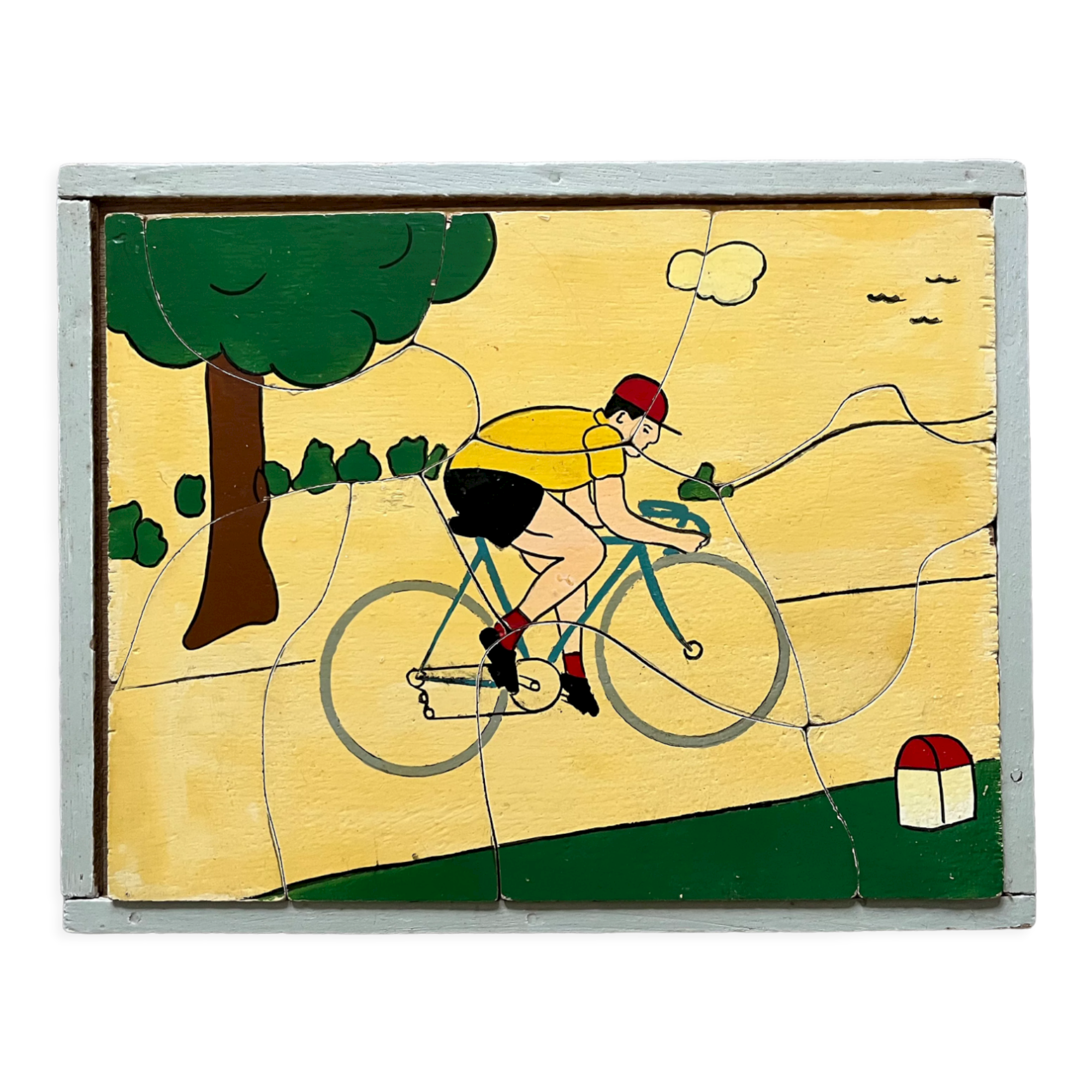 Wooden puzzle frame from the 30s/40s depicting a cyclist