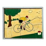 Cadre puzzle en bois des années 30/40 représentant un cycliste