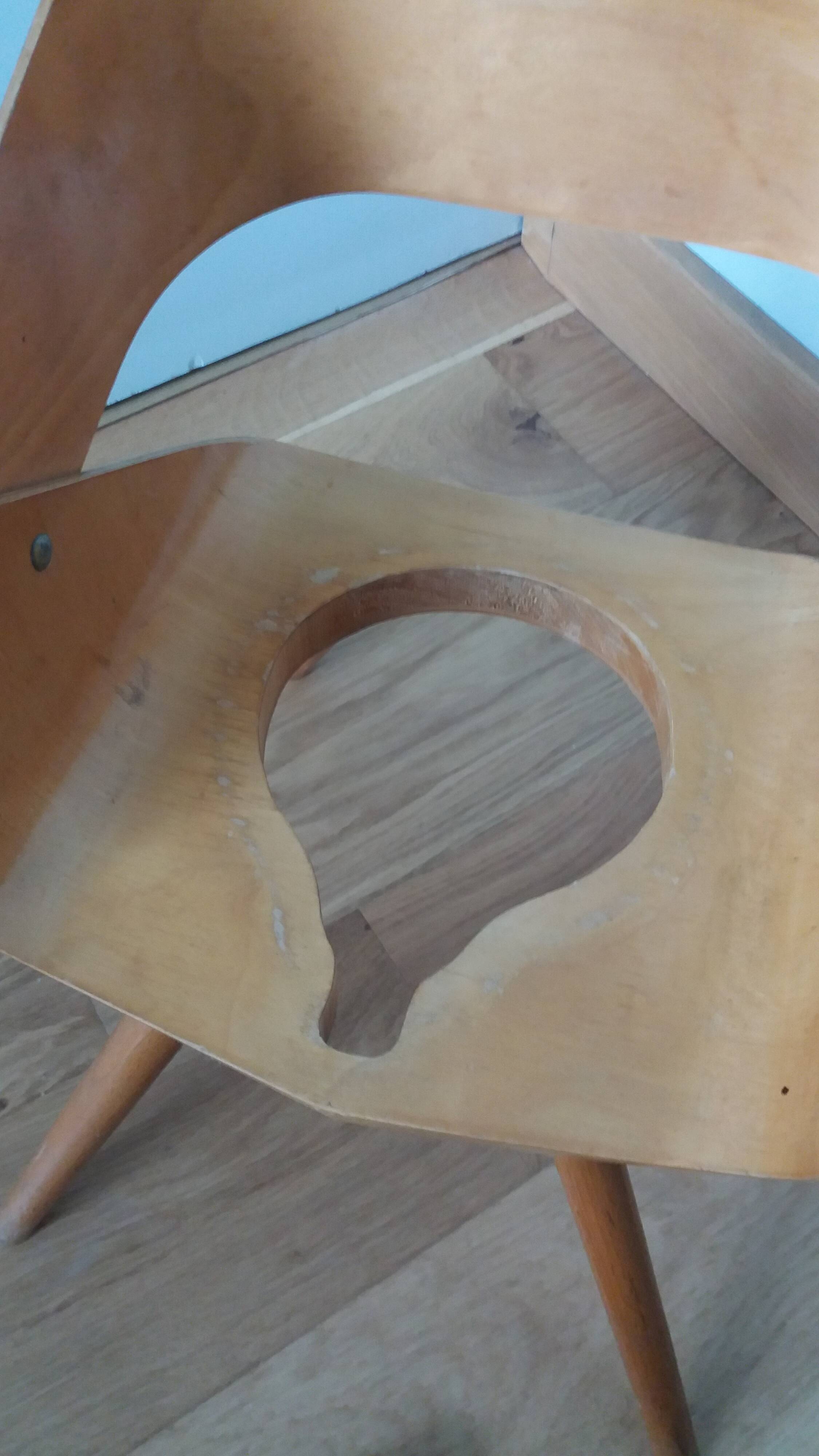 Baumann Baby Coquille children's armchair in bent wood with splayed legs.