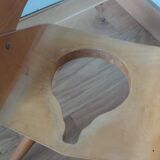 Baumann Baby Coquille children's armchair in bent wood with splayed legs.