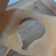 Baumann Baby Coquille children's armchair in bent wood with splayed legs.