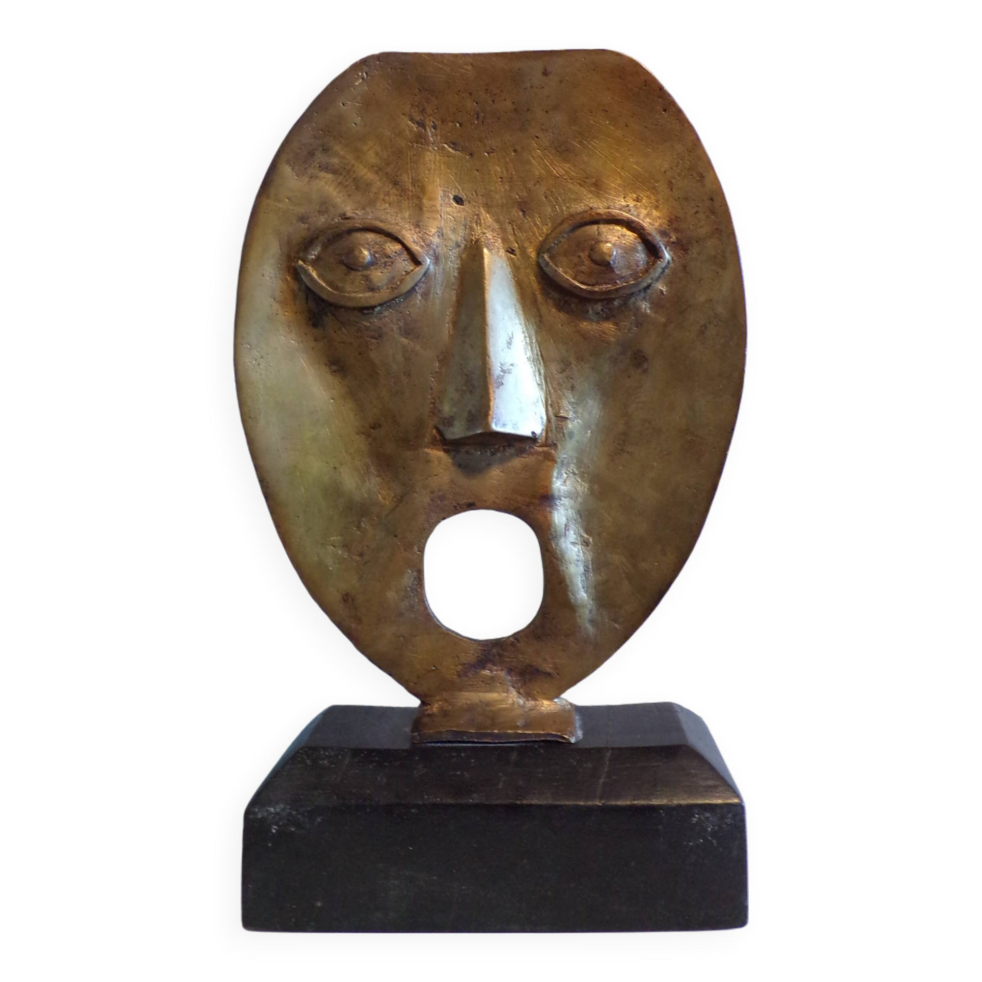 brutalist bronze face sculpture