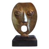 brutalist bronze face sculpture