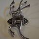 Chrome iron circular coat holder