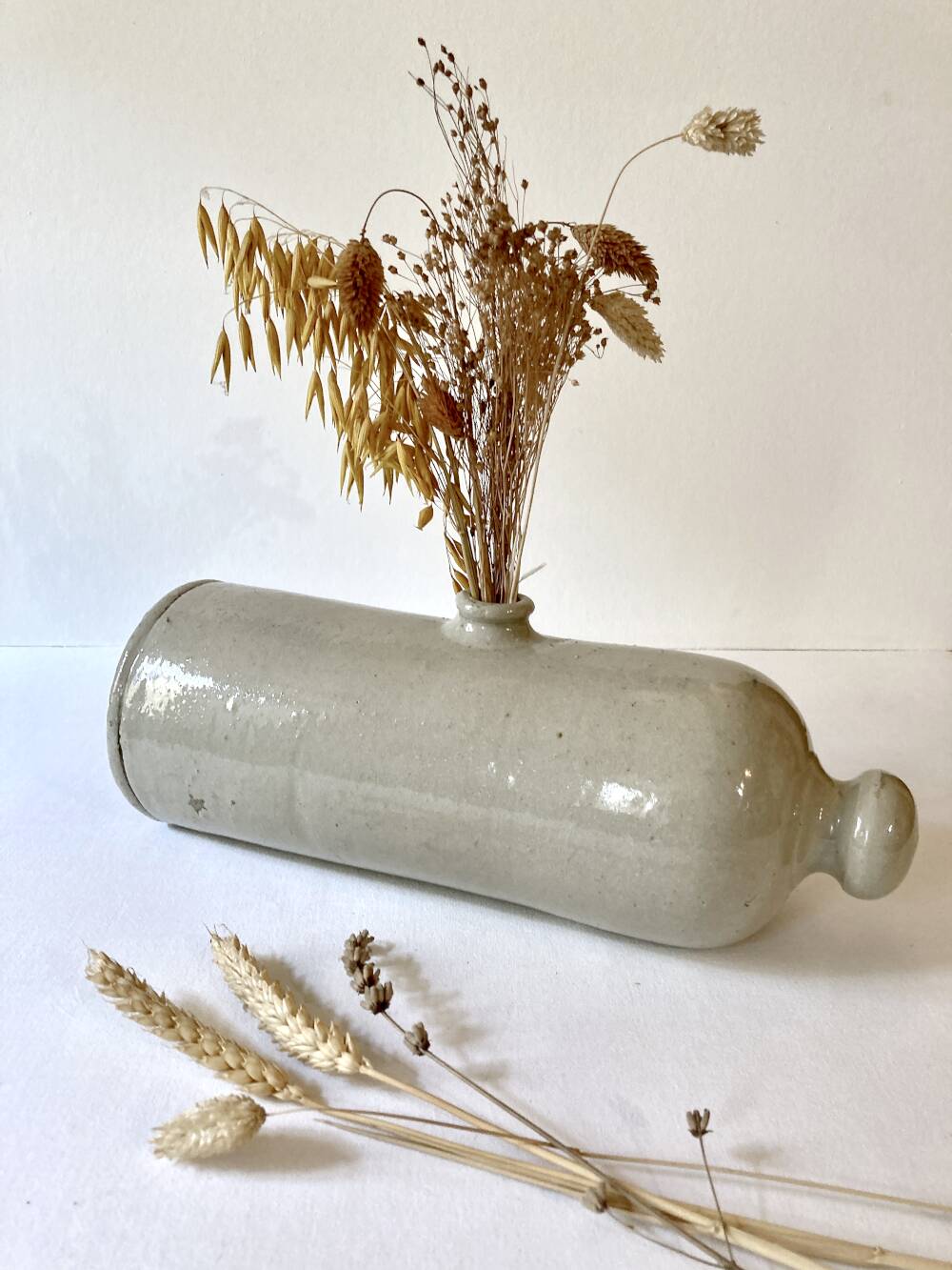 Old horizontal glazed stoneware hot water bottle, late 19th century.