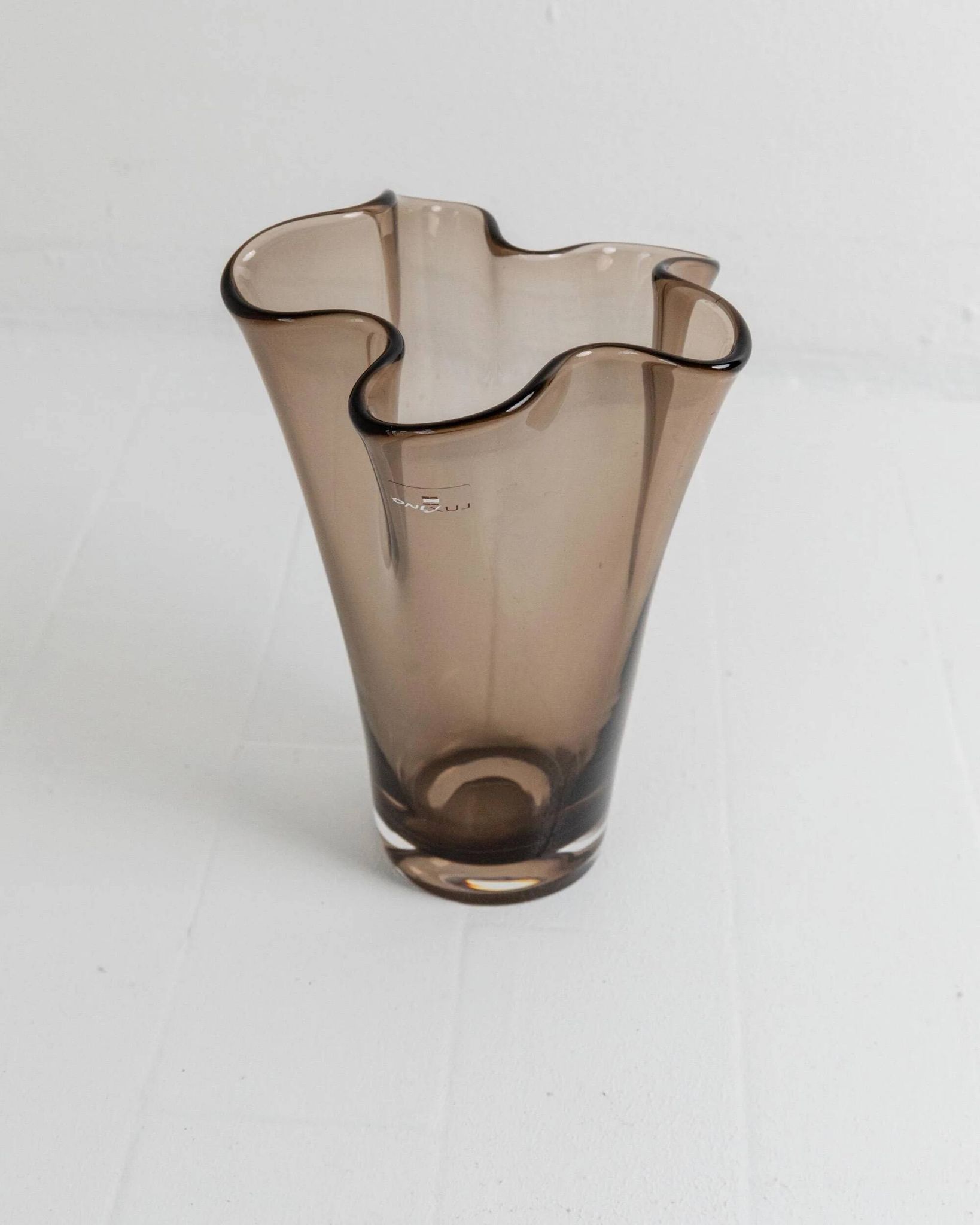 Vintage Murano glass vase from the 1980s, smoky brown, organically wavy shape.