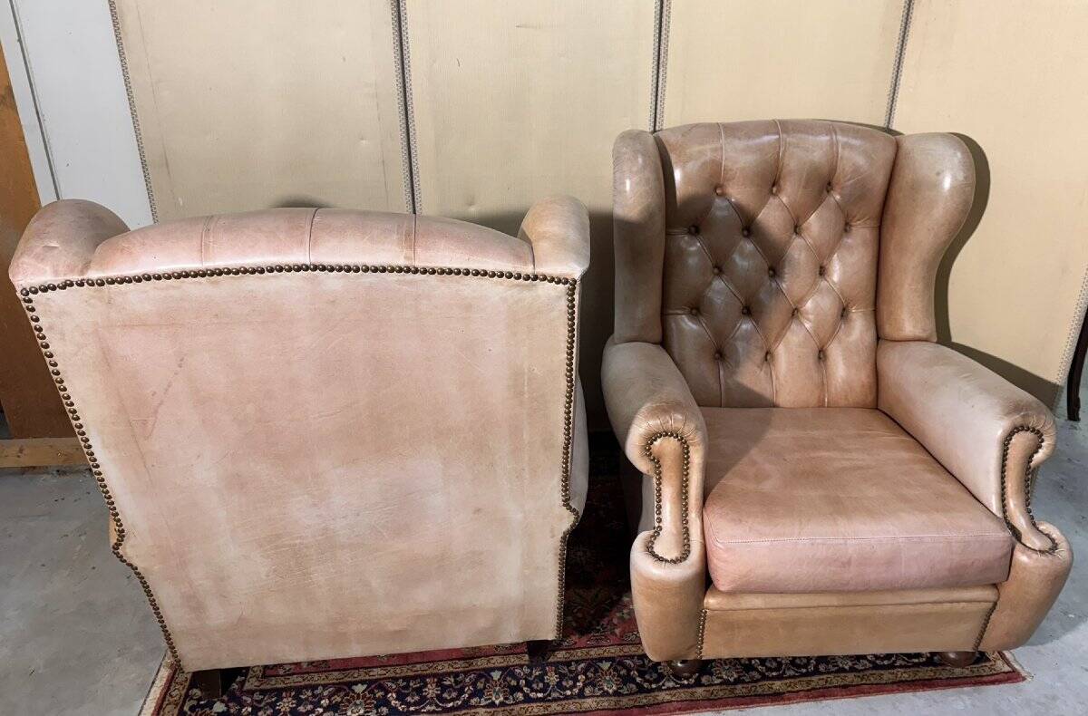 Pair of Chesterfield leather wingback armchairs