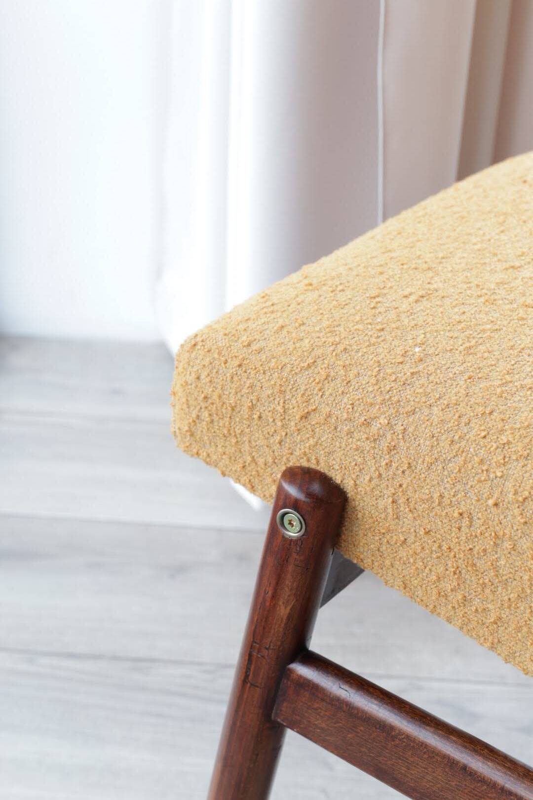 Yellow vintage lounge chair armrests boucle upholstery, walnut wood, Scandi