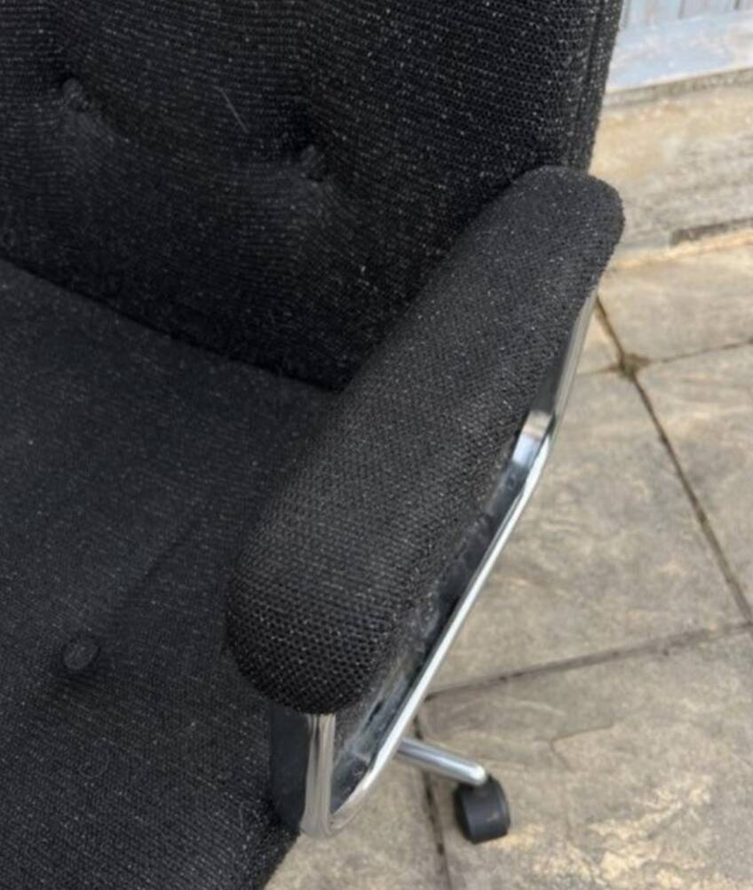 Black mottled fabric and chrome swivel armchair, 1