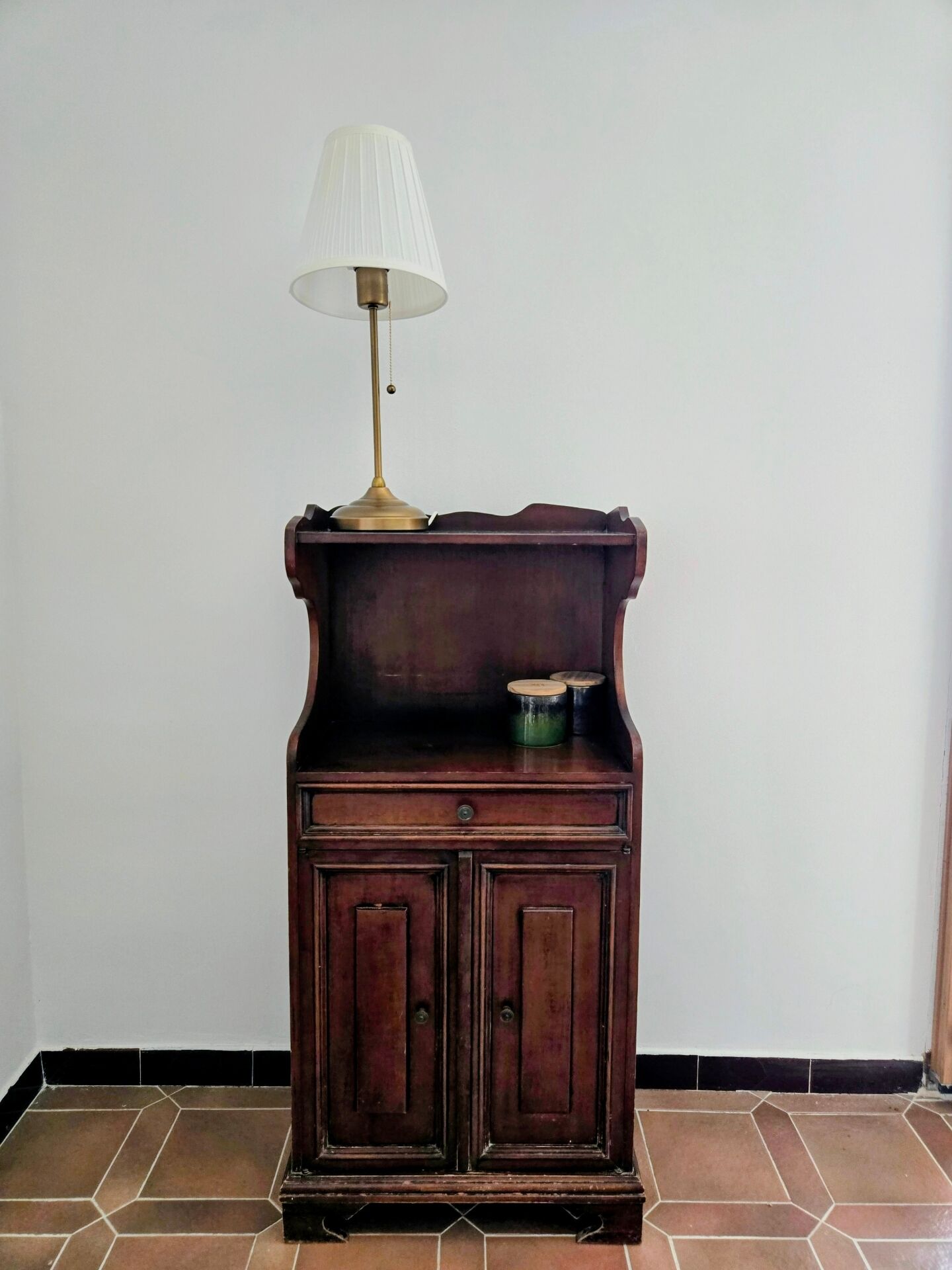 Small antique accent table made of solid wood.