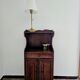 Small antique accent table made of solid wood.