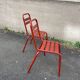 2 red metal Tolix-style chairs, France 1950