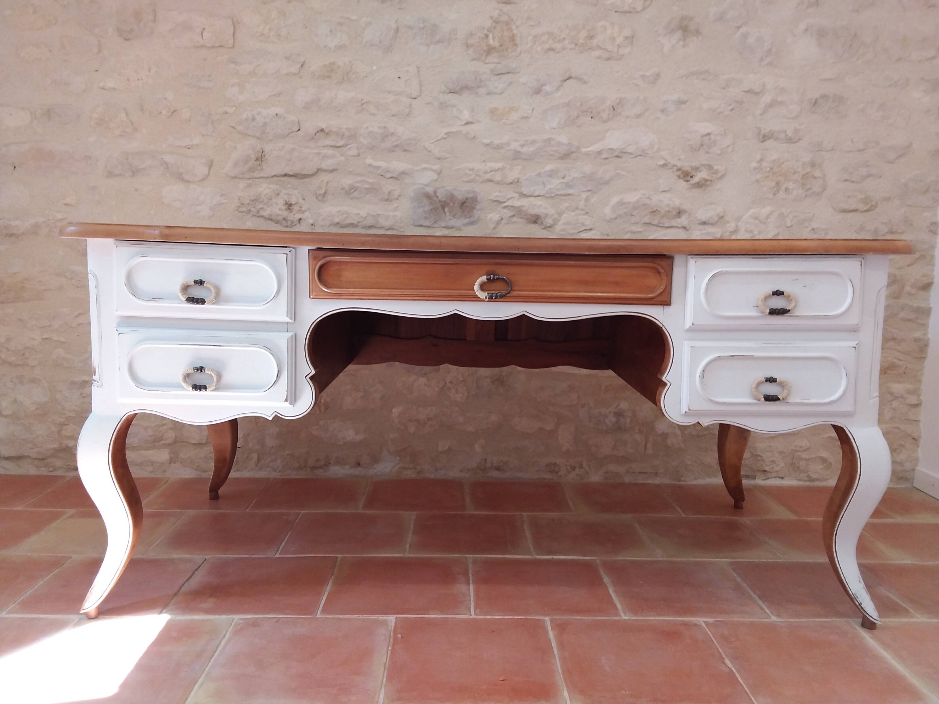 Solid wood desk with distressed white paint.