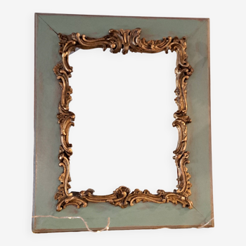 Antique Louis XV style mirror in wood and gilded stucco.