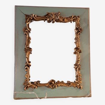 Miroir ancien de style Louis XV en bois et stuc doré.