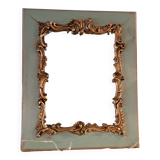 Miroir ancien de style Louis XV en bois et stuc doré.