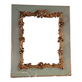 Antique Louis XV style mirror in wood and gilded stucco.