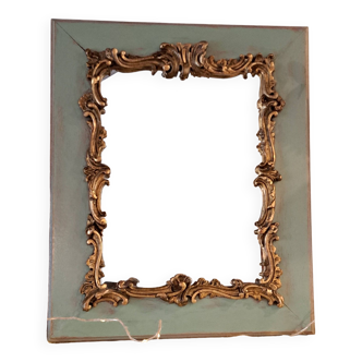Miroir ancien de style Louis XV en bois et stuc doré.
