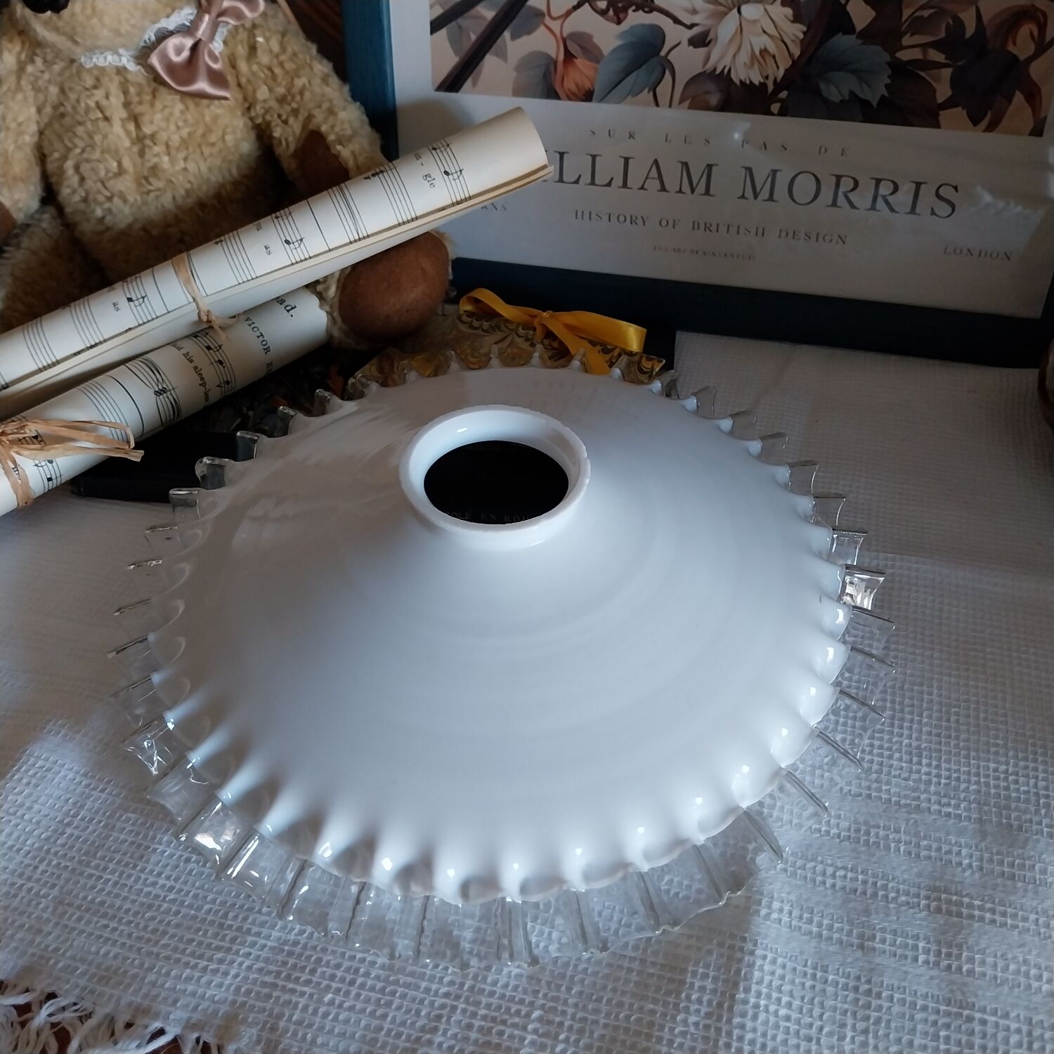 Old lace-edged conical lampshade in opaline