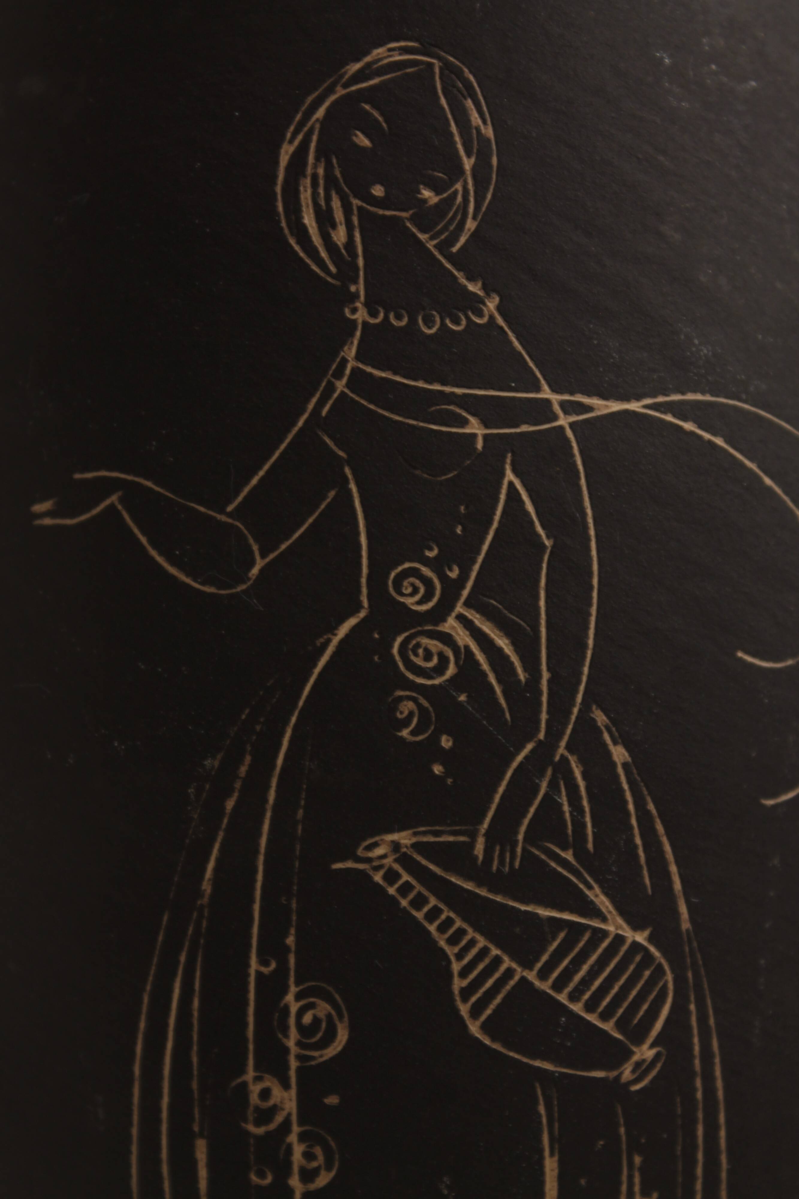 Ceramic vase decorated with women and a tree.