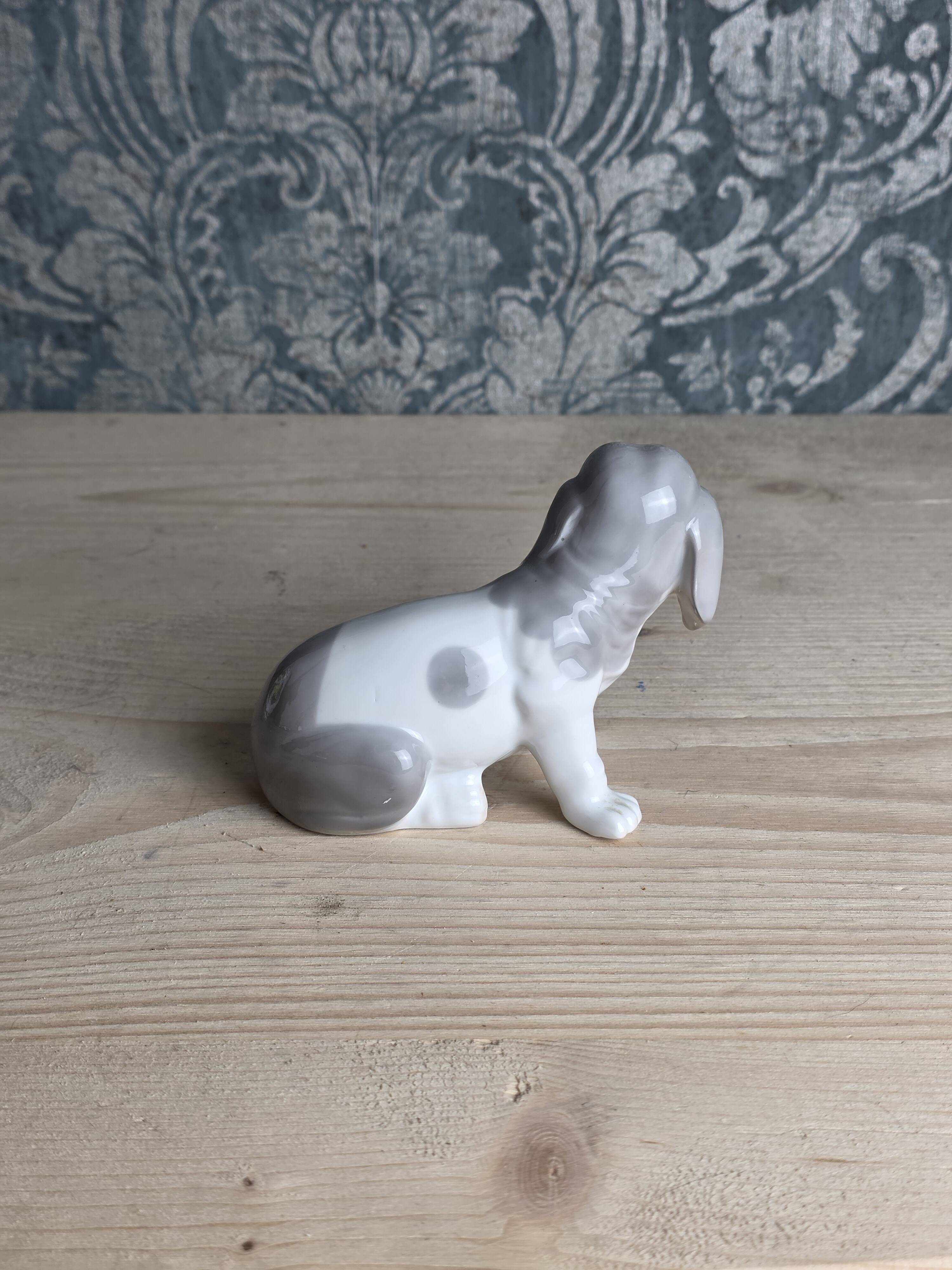 Small spaniel dog in porcelain