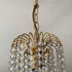 Small vintage brass chandelier with crystal droplets