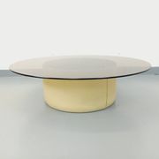 Vintage round coffee table in glass, leather, and metal in Space Age style from the 70s.