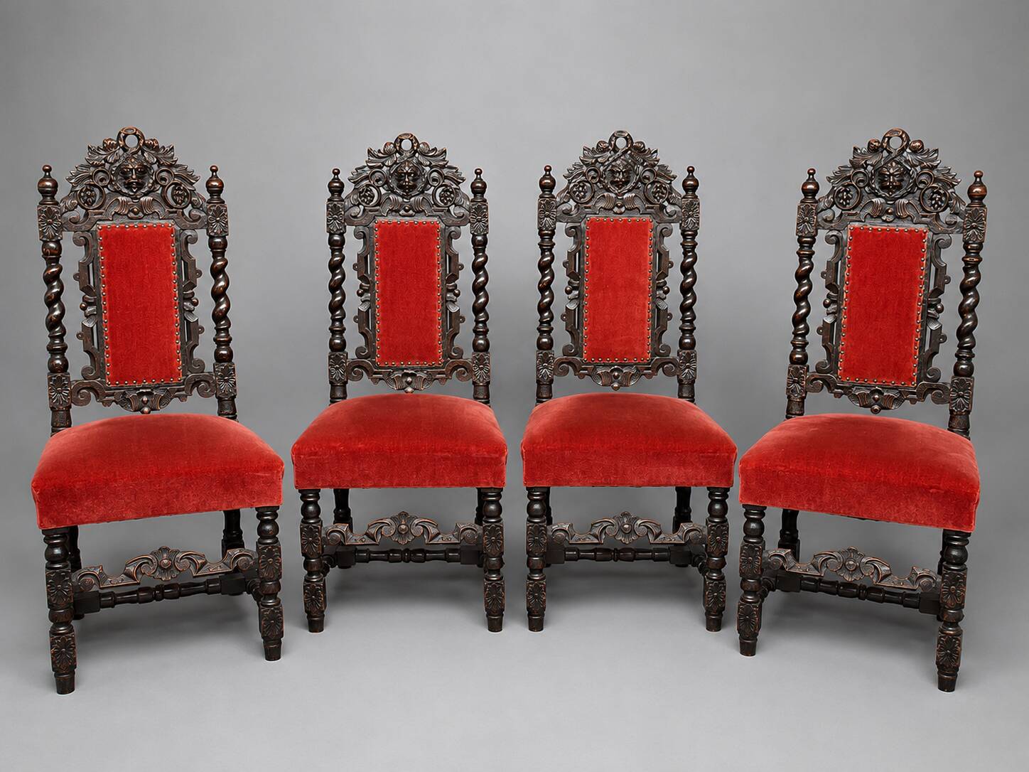Set of 4 antique Renaissance-style oak chairs.