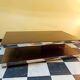 Designer coffee table in glass and chrome metal.