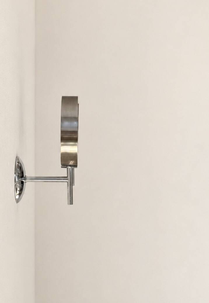Pair of vintage chrome metal wall lights, France, 1970.