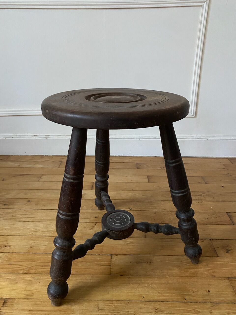 Turned wooden tripod stool