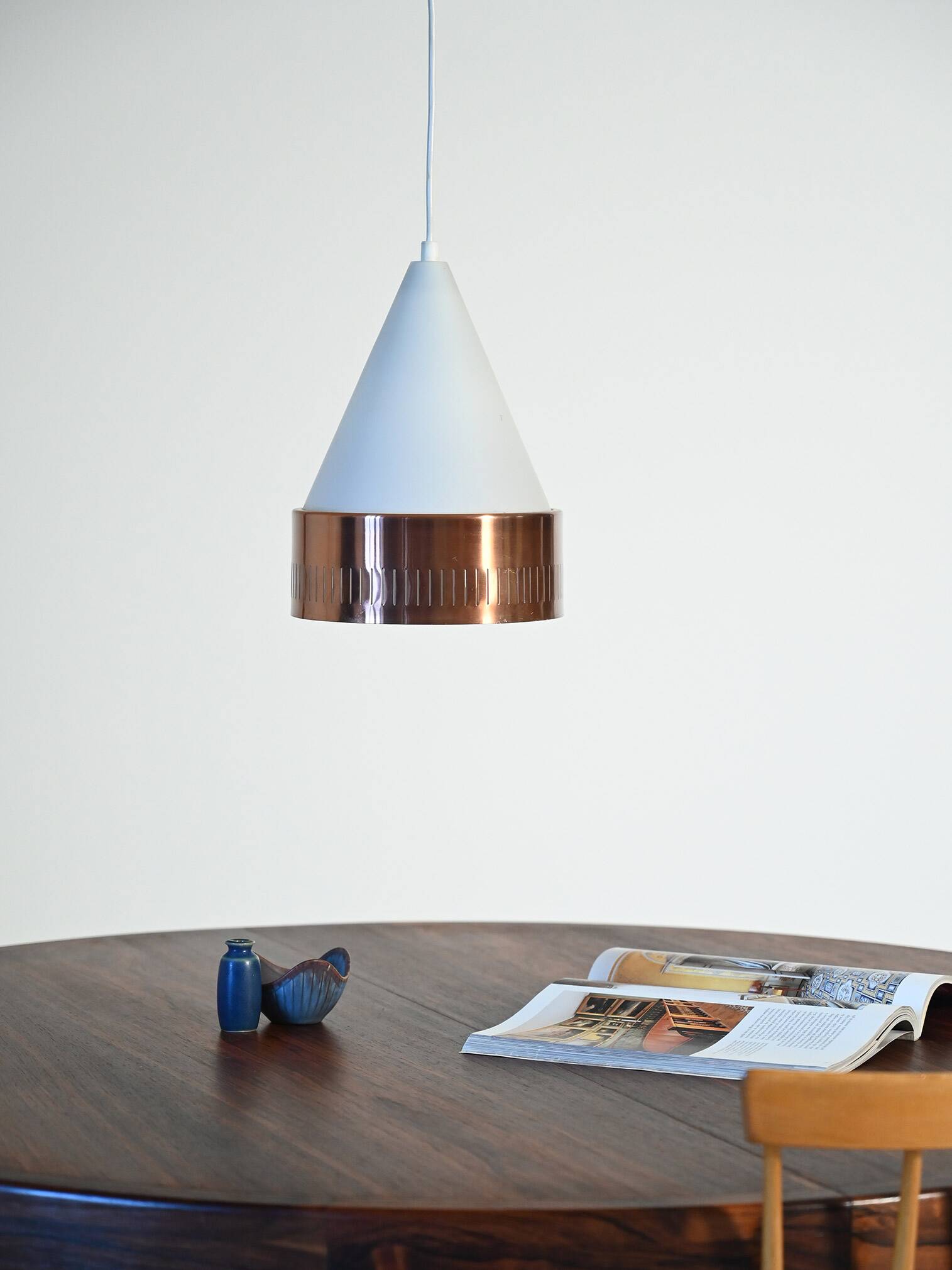 Scandinavian conic pendant lamp with copper detail