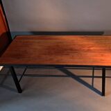 Vintage modernist coffee table in teak and black metal.