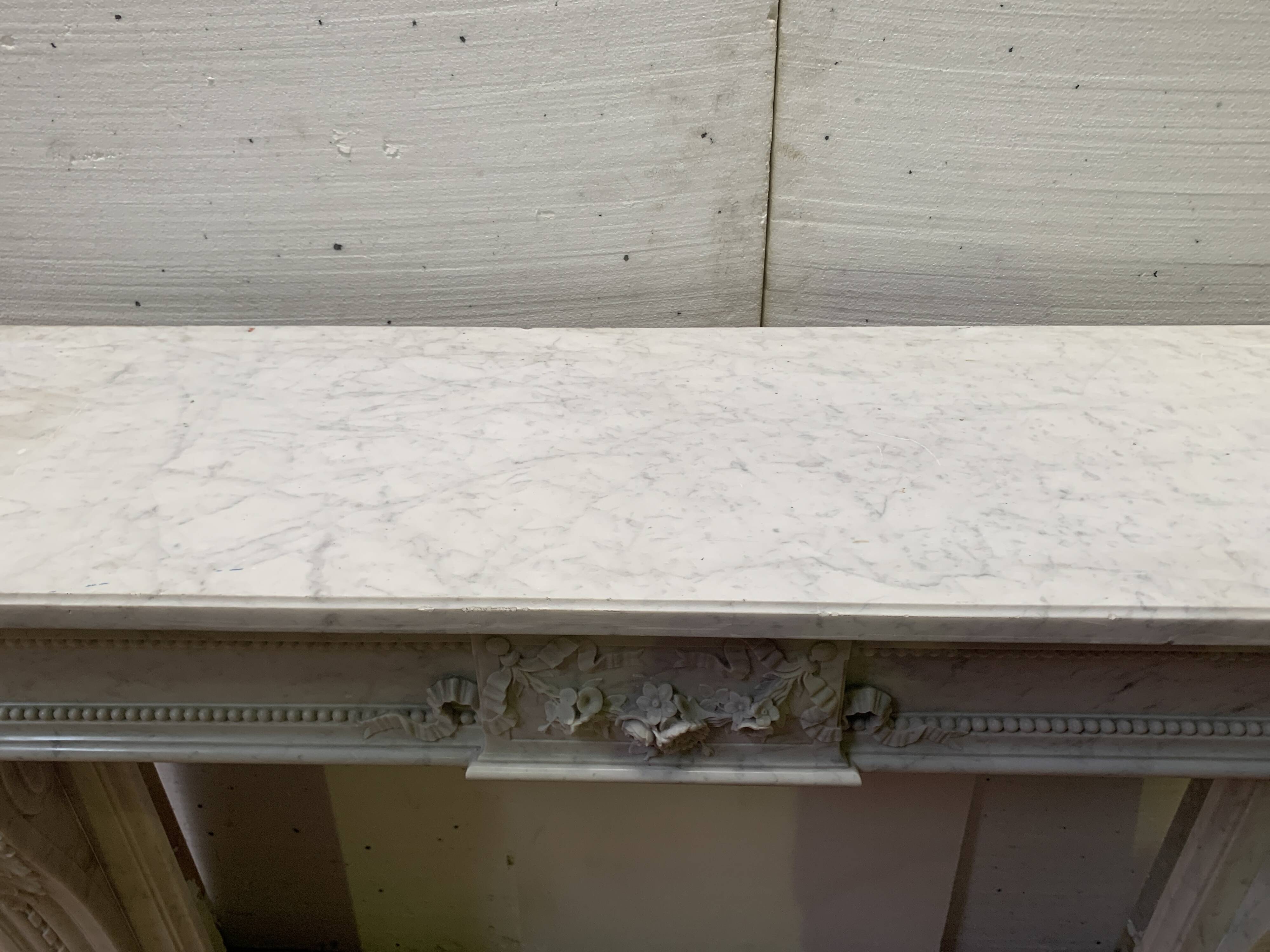 Louis XVI style fireplace in white Carrara marble, 19th century